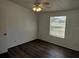 Cozy bedroom with natural light, ceiling fan, and vinyl flooring at 4102 Fox Ridge Blvd, Wesley Chapel, FL 33543