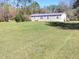 Charming single-story home with a well-maintained lawn and a welcoming porch at 4102 Fox Ridge Blvd, Wesley Chapel, FL 33543