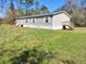Single-story home features gray siding, white trim, and a well-maintained lawn at 4102 Fox Ridge Blvd, Wesley Chapel, FL 33543