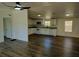 Updated kitchen with granite countertops and white appliances open to living area at 4102 Fox Ridge Blvd, Wesley Chapel, FL 33543