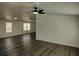 Comfortable living room with updated floors and ceiling fan at 4102 Fox Ridge Blvd, Wesley Chapel, FL 33543
