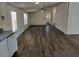 Bright living room with new floors open to the kitchen at 4102 Fox Ridge Blvd, Wesley Chapel, FL 33543