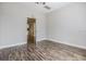 Bedroom features wood-look flooring, neutral paint, and lots of natural light at 4301 Coronet Rd, Plant City, FL 33566