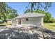 Exterior view of home showing yard and vinyl siding at 4301 Coronet Rd, Plant City, FL 33566