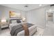 Cozy main bedroom with contemporary decor, tiled floors, and a ceiling fan at 500 Glennes Ln # 205, Dunedin, FL 34698