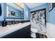 Bright bathroom with modern fixtures, stylish vanity, and elegant shower curtain for a serene and stylish space at 5153 Bay Blvd, Port Richey, FL 34668