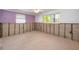 Bedroom shows the ceiling fan, unfinished walls, and windows at 5153 Bay Blvd, Port Richey, FL 34668