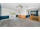 Living room featuring carpet and slider to the balcony at 5153 Bay Blvd, Port Richey, FL 34668