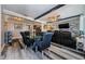 Open-concept living space with dining area, stylish seating, and modern kitchen creates a welcoming and functional space at 5153 Bay Blvd, Port Richey, FL 34668
