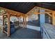 Outdoor kitchen under a covered gazebo with a built-in grill and wooden beams at 5153 Bay Blvd, Port Richey, FL 34668
