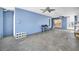 Covered patio featuring concrete flooring, ceiling fans, and convenient bar seating at 5153 Bay Blvd, Port Richey, FL 34668