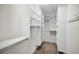 Custom walk-in closet with ample shelving and hanging space to maximize storage at 5153 Bay Blvd, Port Richey, FL 34668