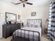 Comfortable bedroom featuring dresser, mirror and neutral paint at 5714 Colony Glen Rd, Lithia, FL 33547