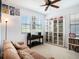 Bright bedroom featuring comfortable couch, storage, and natural light at 5714 Colony Glen Rd, Lithia, FL 33547