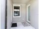Enclosed entryway featuring two doors, and black trimmed window at 5714 Colony Glen Rd, Lithia, FL 33547