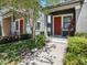 Charming home with inviting walkway, lovely front yard, and vibrant landscaping at 5714 Colony Glen Rd, Lithia, FL 33547