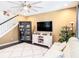 Cozy living room with fan, modern furnishings, display case, and dark wood flooring at 5714 Colony Glen Rd, Lithia, FL 33547