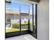 Screened porch featuring a view of the backyard with plenty of green foliage at 5714 Colony Glen Rd, Lithia, FL 33547