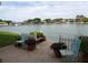 Charming back patio overlooking the water, complete with chairs, plants and serene views at 5955 30Th S Ave # 108, Gulfport, FL 33707