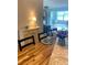 Inviting dining area featuring a wooden table, set tableware, and a charming buffet cabinet at 5955 30Th S Ave # 108, Gulfport, FL 33707