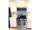 Well-equipped kitchen featuring modern appliances, ample counter space, and bright cabinetry at 5955 30Th S Ave # 108, Gulfport, FL 33707