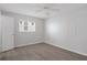 Bedroom with a ceiling fan, wood floor, and a single window at 5980 Shore S Blvd # 312, Gulfport, FL 33707