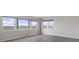 Bright bedroom featuring luxury vinyl floors, neutral walls, and large windows with beautiful water views at 5980 Shore S Blvd # 312, Gulfport, FL 33707