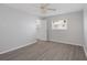 Bedroom with a ceiling fan, wood floor, and a single window at 5980 Shore S Blvd # 312, Gulfport, FL 33707
