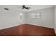 Spacious bedroom with ceiling fan, hardwood floors, neutral walls and a bathroom nearby at 5980 Shore S Blvd # 312, Gulfport, FL 33707