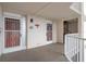 Exterior hallway with security doors, unit number 312, and staircase access offering safety and convenience at 5980 Shore S Blvd # 312, Gulfport, FL 33707