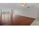 Open-concept living room featuring hardwood floors, bright windows, and ample space for comfortable living and entertaining at 5980 Shore S Blvd # 312, Gulfport, FL 33707