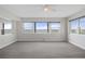 Light and bright living room featuring luxury vinyl floors, neutral walls, and large windows with beautiful water views at 5980 Shore S Blvd # 312, Gulfport, FL 33707