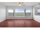 Inviting living room with hardwood floors and expansive windows offering picturesque water views for a tranquil living experience at 5980 Shore S Blvd # 312, Gulfport, FL 33707