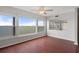 Bright living room featuring hardwood floors, large windows with scenic views, and a seamless flow into adjacent spaces at 5980 Shore S Blvd # 312, Gulfport, FL 33707