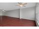 Expansive living area with hardwood flooring, a ceiling fan, and expansive windows for lots of natural light at 5980 Shore S Blvd # 312, Gulfport, FL 33707