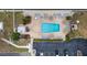 Aerial view of the community pool, showcasing ample lounge chairs and well-maintained landscaping at 5980 Shore S Blvd # 312, Gulfport, FL 33707