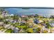 An aerial view of a neighborhood near the water featuring large homes and green space at 6070 Denver Ne St, St Petersburg, FL 33703