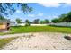 Large backyard featuring brick oven, spacious grass area, and well-maintained patio pavers at 6070 Denver Ne St, St Petersburg, FL 33703