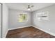 Bedroom featuring hardwood floors and two windows with lovely natural light at 6070 Denver Ne St, St Petersburg, FL 33703