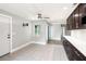 Bright dining area with neutral walls, tiled floors, and seamless transition to the updated kitchen at 6070 Denver Ne St, St Petersburg, FL 33703