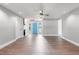 Bright living room with stylish floors, neutral walls, and seamless transition to the entryway at 6070 Denver Ne St, St Petersburg, FL 33703