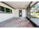 Enclosed patio featuring access door to the backyard, window and screening at 6070 Denver Ne St, St Petersburg, FL 33703