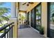 Charming balcony featuring contemporary chairs and peaceful views of the surrounding landscape at 6412 Mayra Shores Ln, Apollo Beach, FL 33572