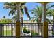Covered balcony with columns offering stunning views of tropical landscaping and the ocean beyond at 6412 Mayra Shores Ln, Apollo Beach, FL 33572