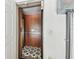 Interior elevator with wood paneling and a star patterned floor at 6412 Mayra Shores Ln, Apollo Beach, FL 33572