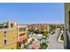 A view of the property with palm trees and well-maintained landscaping at 6412 Mayra Shores Ln, Apollo Beach, FL 33572