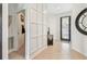 Bright foyer features neutral tile and a dark wood trimmed front door at 6412 Mayra Shores Ln, Apollo Beach, FL 33572