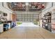 Spacious garage with ample storage solutions and overhead racks to help keep your items organized at 6412 Mayra Shores Ln, Apollo Beach, FL 33572