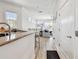 Open-concept living area with bar seating and views of the bright and comfortable living space at 6412 Mayra Shores Ln, Apollo Beach, FL 33572
