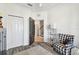 Inviting living room with chair, plush rug, and easy access to a hallway and closet at 6412 Mayra Shores Ln, Apollo Beach, FL 33572